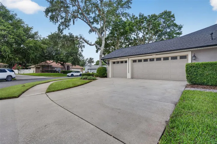 3 Car Garage has plenty of room for toys in this Golf cart friendly, lakefront community!
