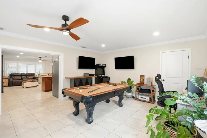 This is a large Family room or multi-purpose room (currently being used as a Dining Room and Game Room