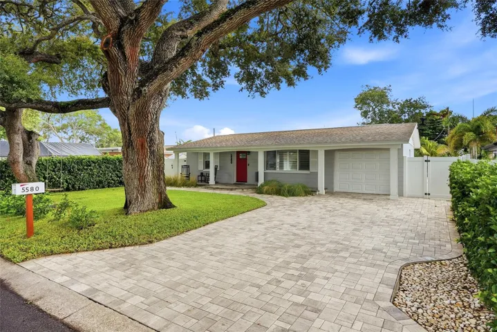 Welcome to 5580 Tangelo Rd with warm and inviting curb appeal!