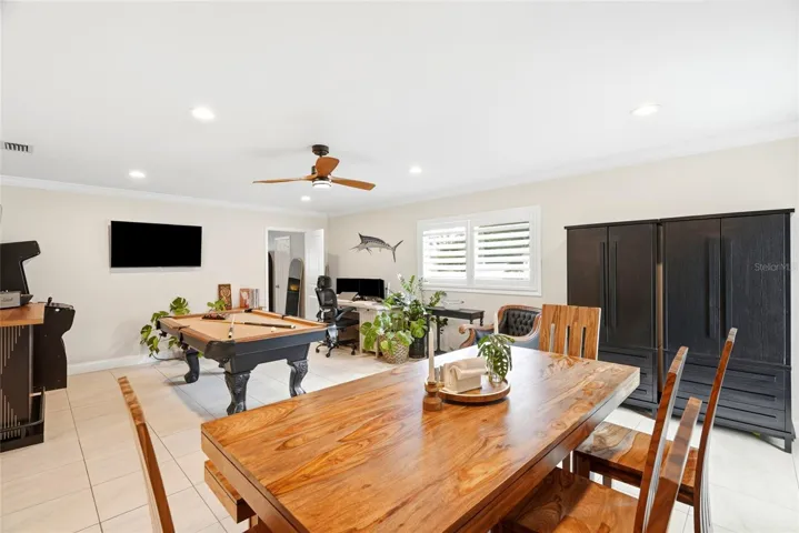 This is a large Family room or multi-purpose room (currently being used as a Dining Room and Game Room