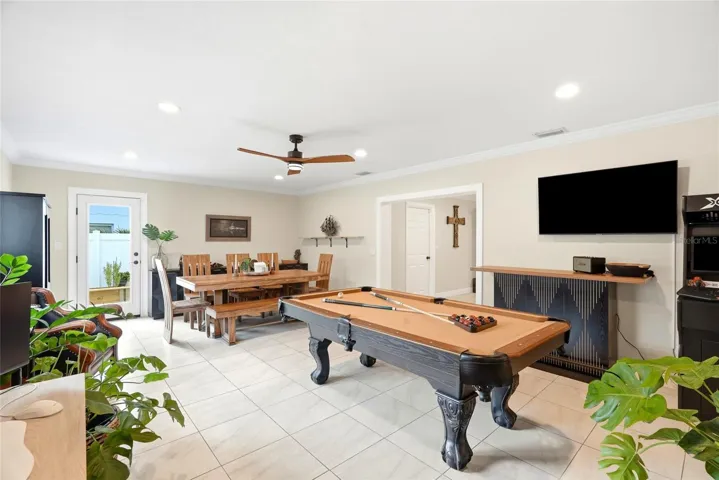 This is a large Family room or multi-purpose room (currently being used as a Dining Room and Game Room