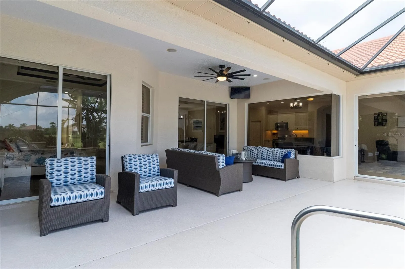Covered Lanai Seating Area Overlooking the Resort-Style Pool