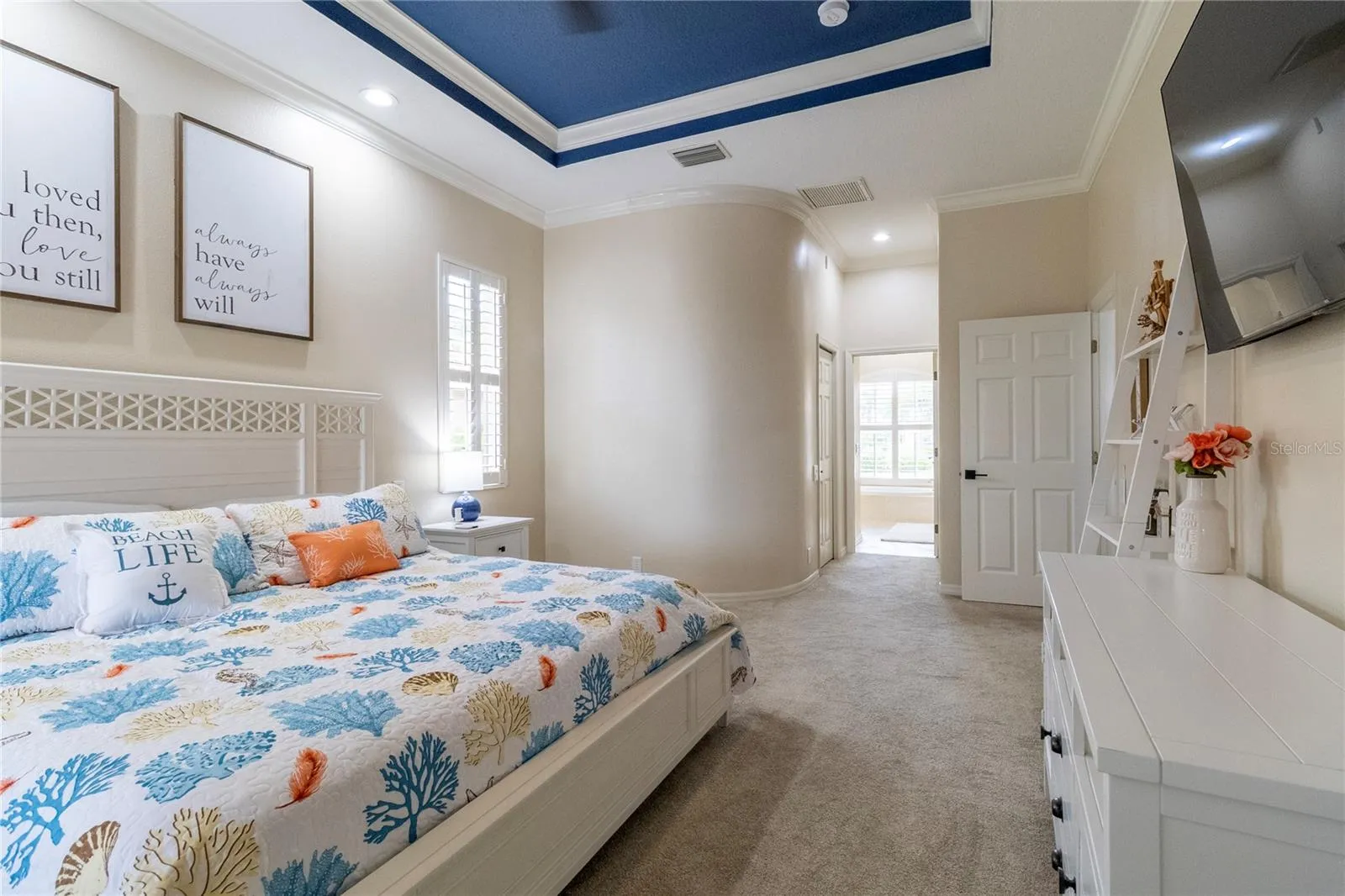 Luxurious Primary Suite Leading to Inspired Bathroom