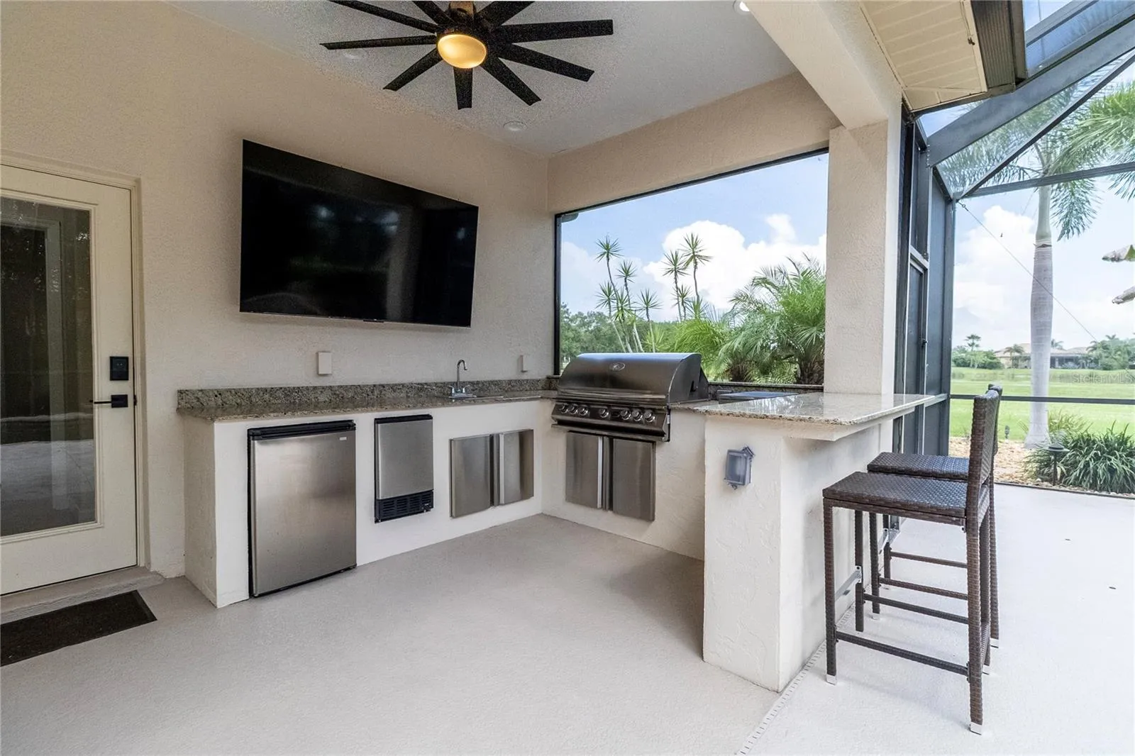 Outdoor Entertaining Space with Kitchen, Bar &amp; TV