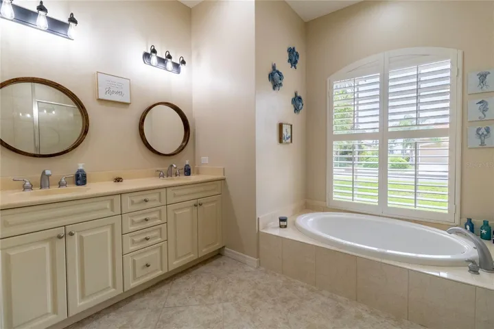 Luxurious Primary Bathroom with Soaking Tub &amp; Dual Vanities