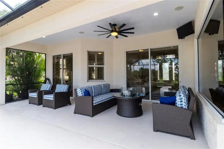 Covered Lanai Seating Area Overlooking the Resort-Style Pool