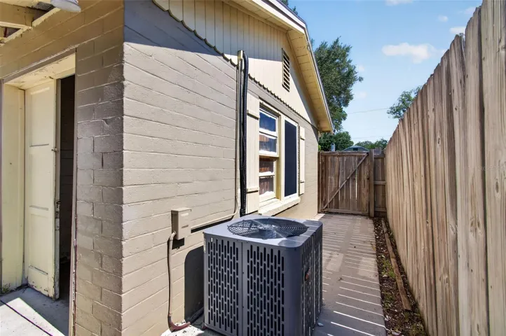 A/C on fenced in side yard