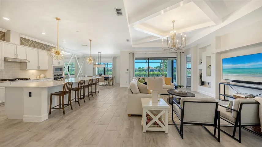 Great room floor plan with coffered ceiling and wall accents