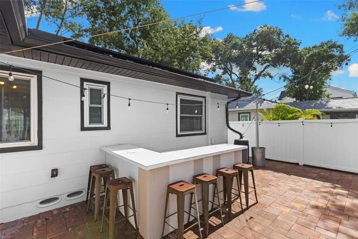 Backyard with Pavers and Vinyl Fence