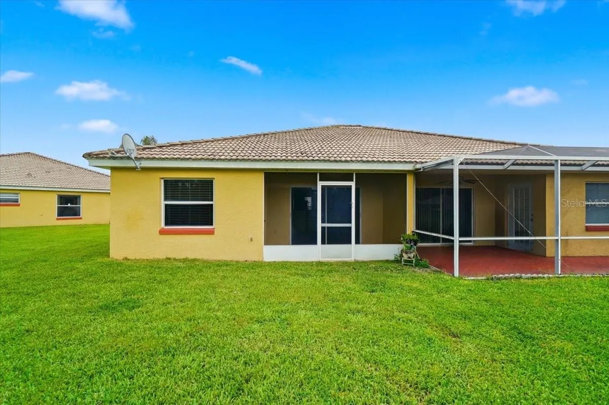 Enclosed rear porch offering peaceful privacy with no rear neighbors; an ideal setting for quiet morning coffee or relaxing evening dinners.