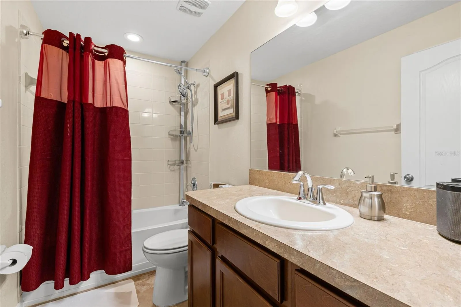 Bathroom 3 includes a tub-and-shower combination, a single vanity with generous counter space and a large wall mirror.