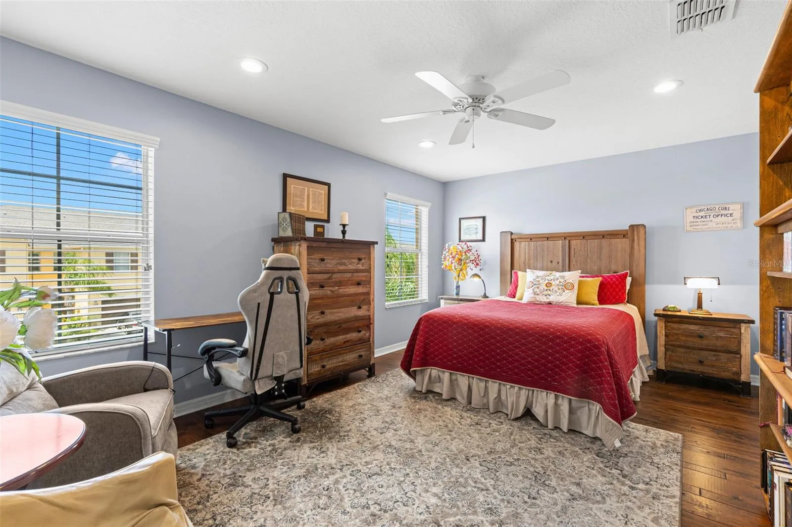 Bedroom 3 is generously sized, with hardwood flooring, a ceiling fan, recessed lighting and enough room for a desk or reading area.