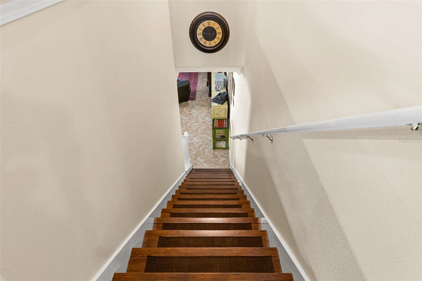 Hardwood continues up the staircase, creating a warmer, more finished look.