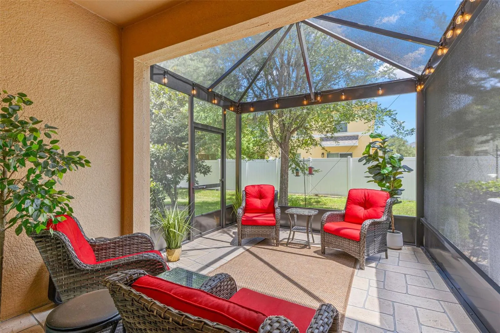 The 13-by-9 screened lanai, added in 2026, features stamped-concrete flooring and 80/90 screening overhead, with plenty of room for comfortable outdoor seating.