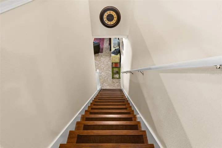 Hardwood continues up the staircase, creating a warmer, more finished look.
