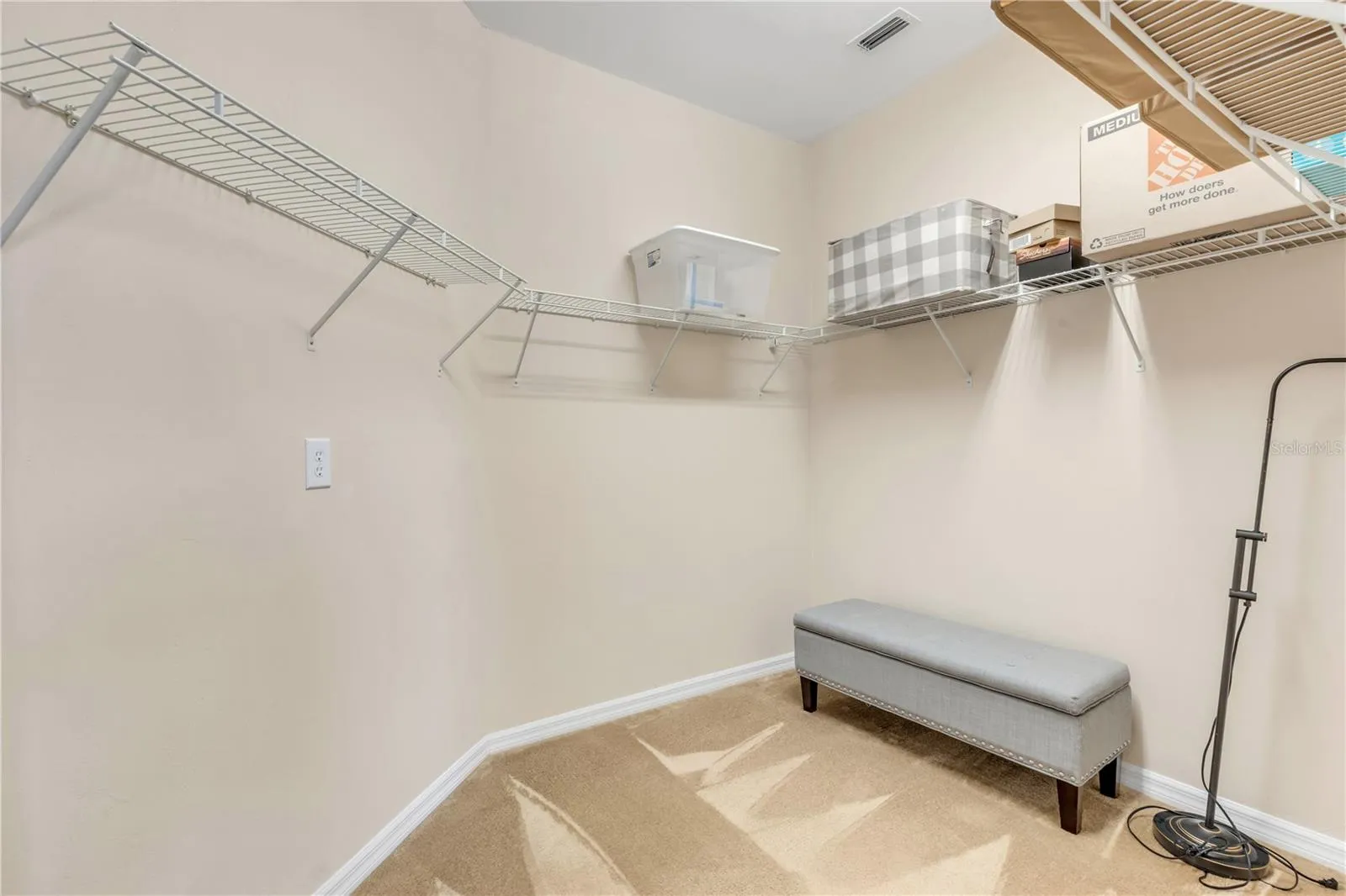 Primary bedroom walk in closet