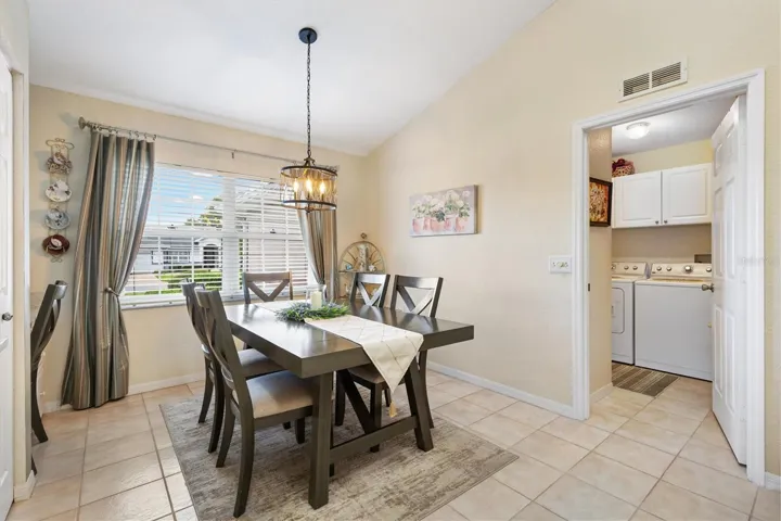 Eat-in Kitchen, laundry room through doorway,  door to left of washer to two car garage.