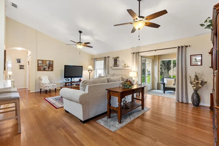 Living room, Florida room through open doorway on right.