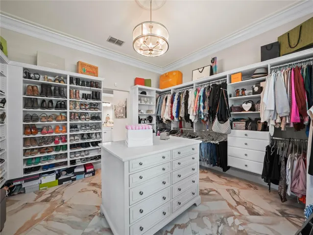 BONUS Third Primary walk in closet with island and dressing area