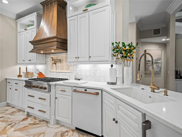 6 Burner gas Cafe cooktop with custom Copper exhaust hood