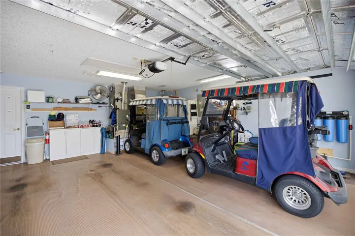 Garage can fit a small SUV and two golf carts.