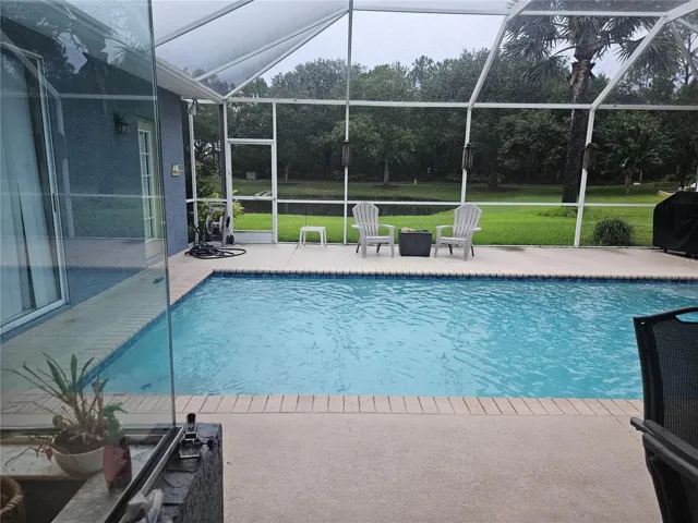 Pool with view of pond
