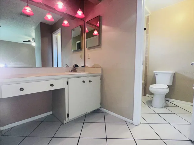 Separate vanity and separate wash/lavatory room.