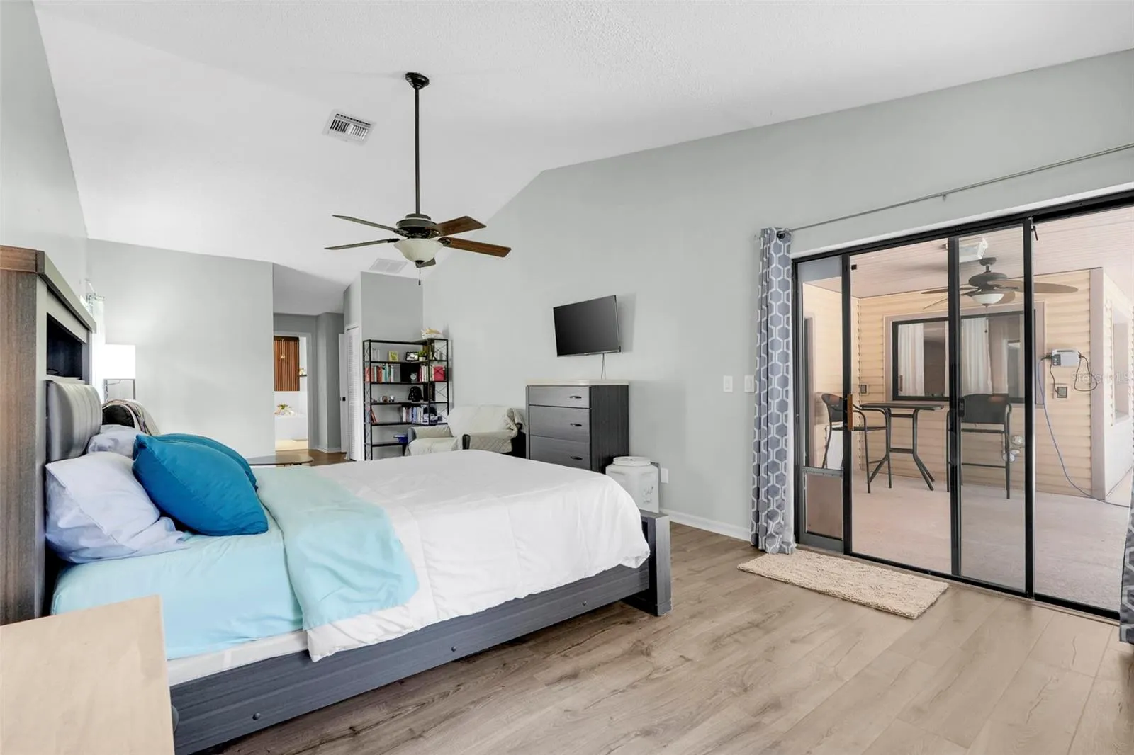 Primary Bedroom with sliding glass doors to pool