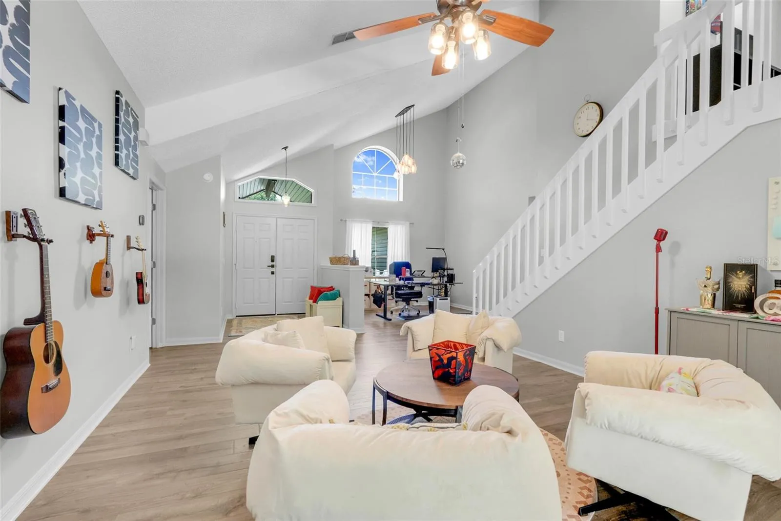 Living Room with open staircase to upstairs