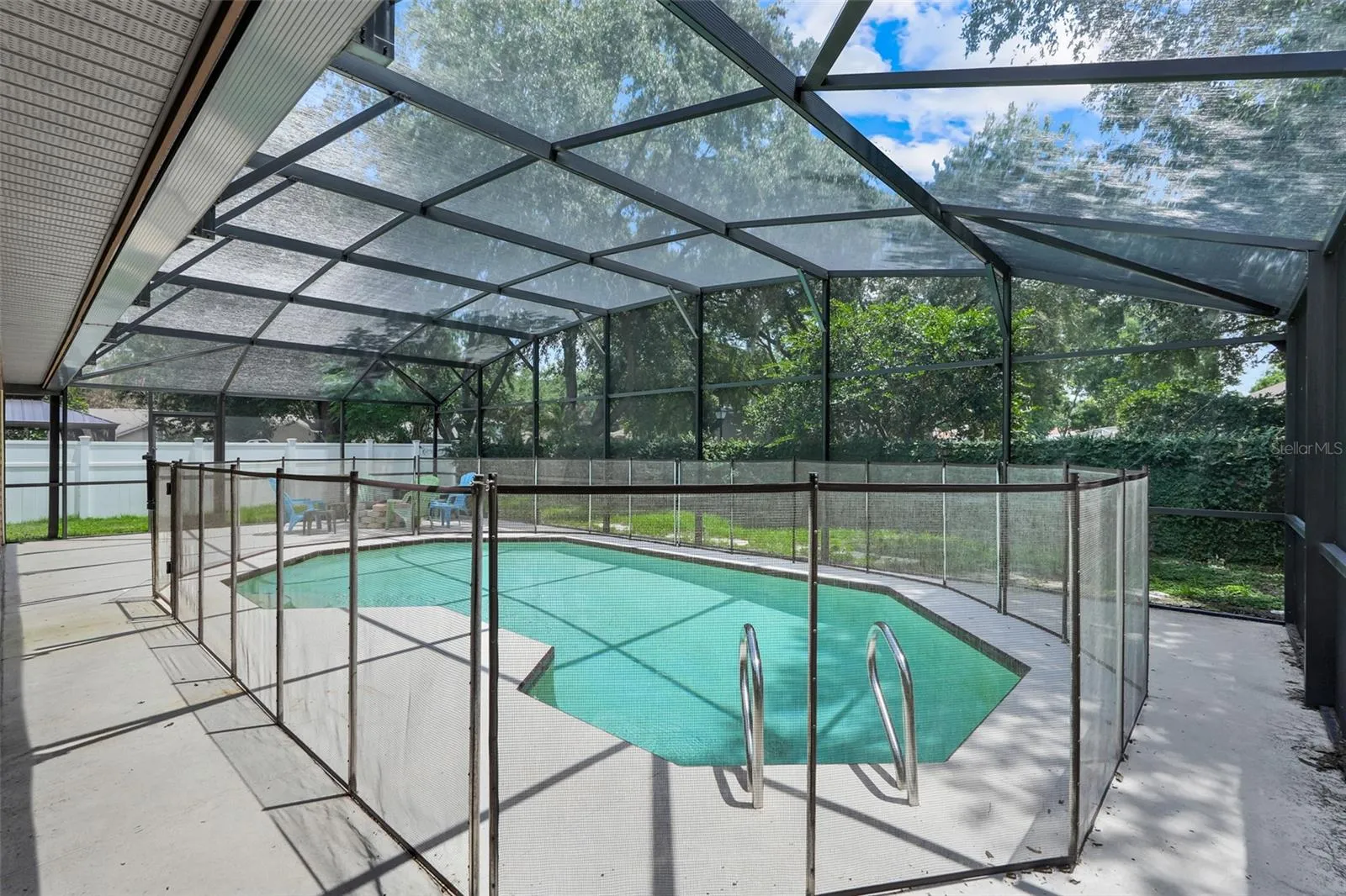 Pool overlooking fully fenced in yard