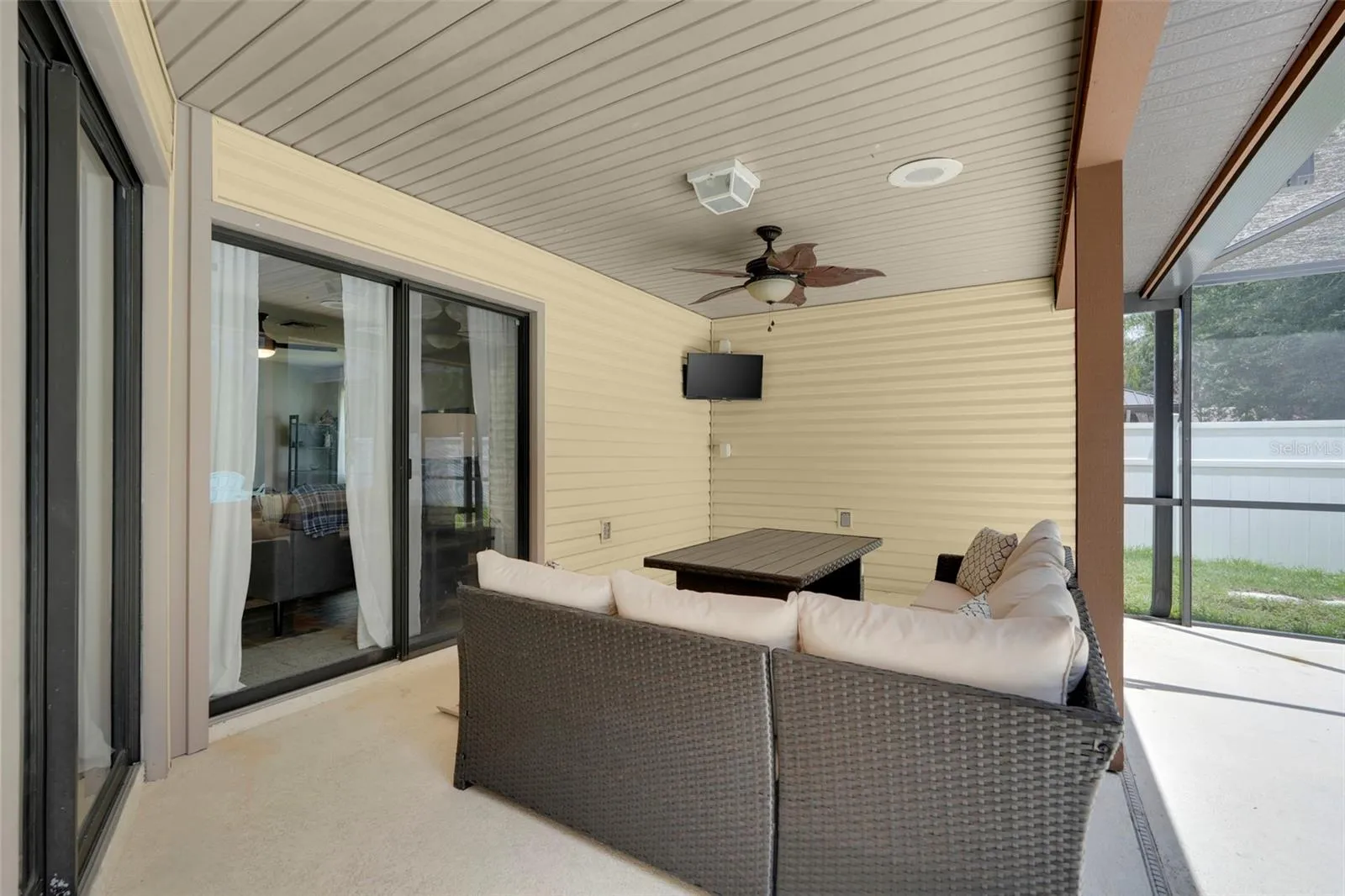 Covered patio with sliding doors coming off the family room and dinette area off kitchen