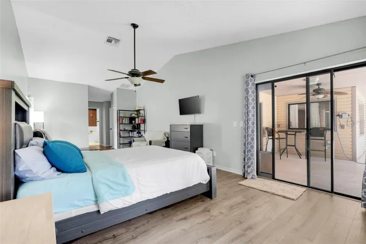 Primary Bedroom with sliding glass doors to pool