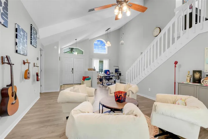 Living Room with open staircase to upstairs