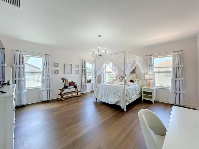 2nd primary suite upstairs with walk in closet and ensuite bathroom