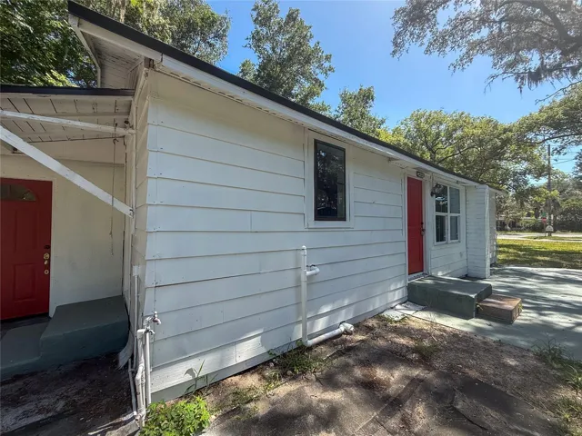 SIDE VIEW OF FRONT DOOR AND LAUNDRY ROOM DOOR