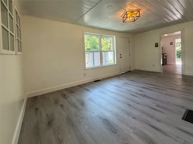 LIVING ROOM SHOWING KITCHEN ENTRY
