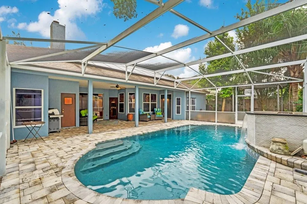 Paver Deck and Screen In Pool with Water / Fire Feature