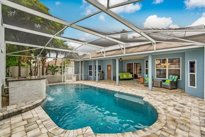 Paver Deck and Screen In Pool with Water / Fire Feature