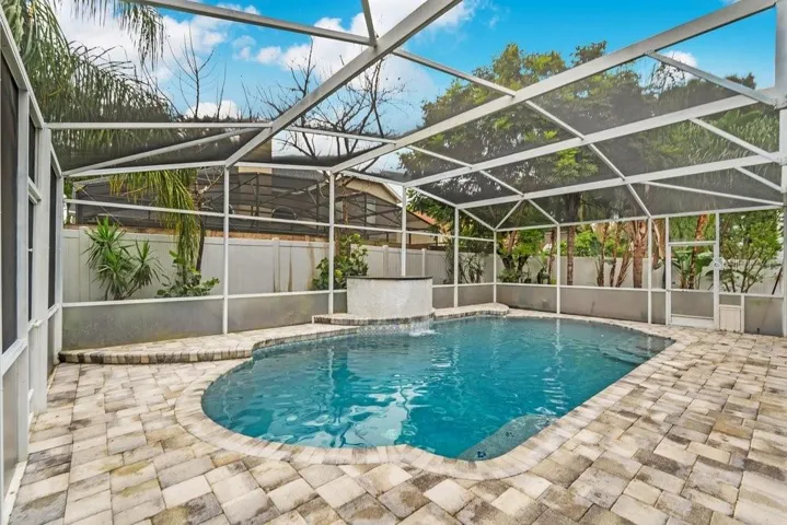Paver Deck and Screen In Pool with Water / Fire Feature