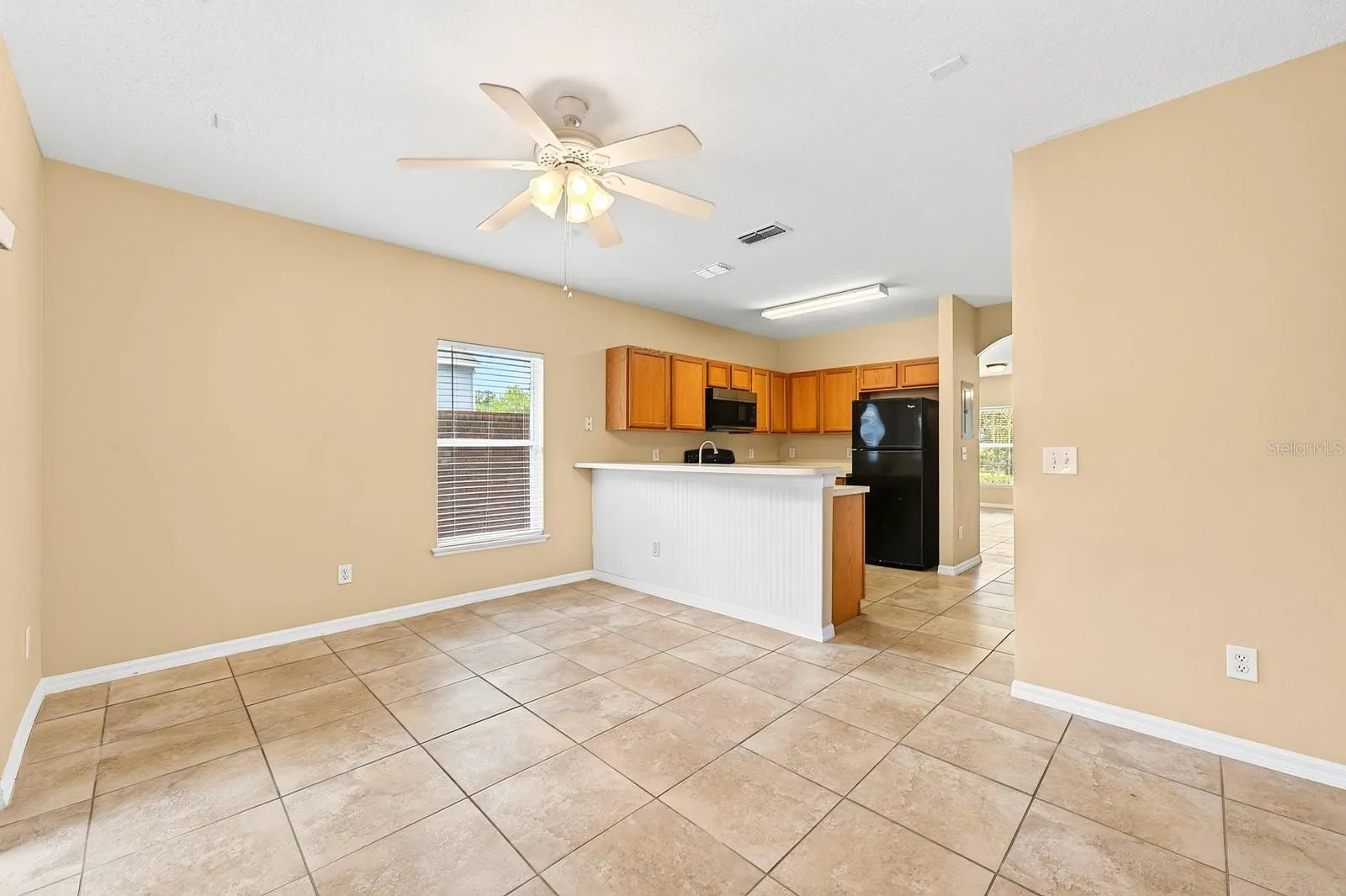 The kitchen is ideally situated between a light filled family room and the open living and dining.