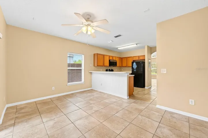The kitchen is ideally situated between a light filled family room and the open living and dining.