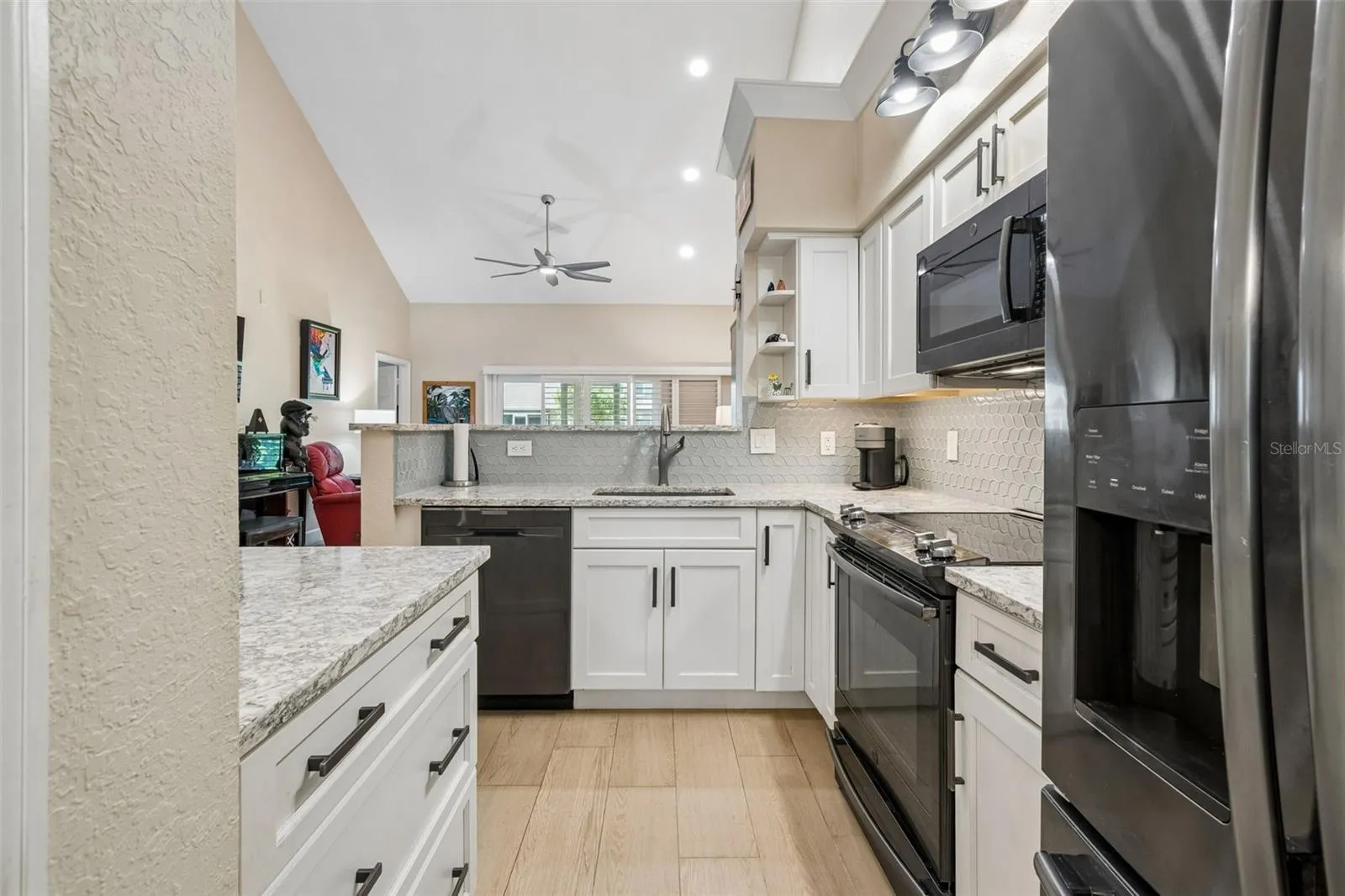 Updated kitchen with granite counter tops.