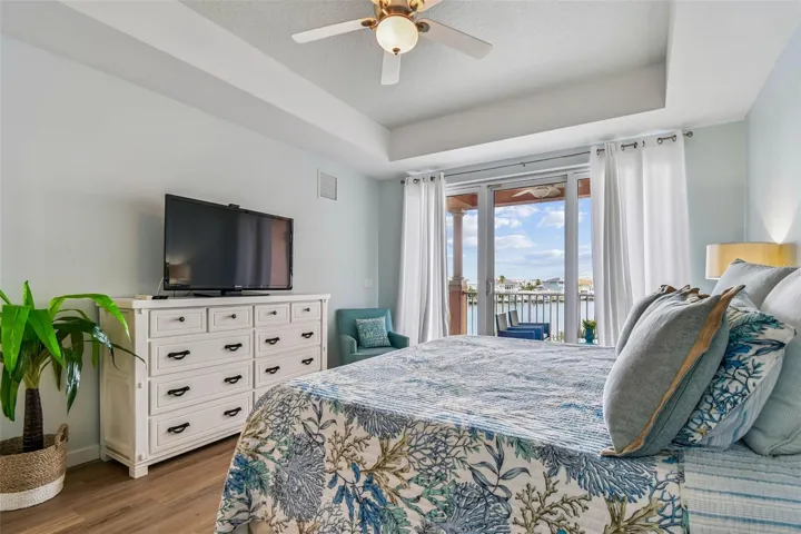 Primary bedroom provides light and views from sliders in master bedroom