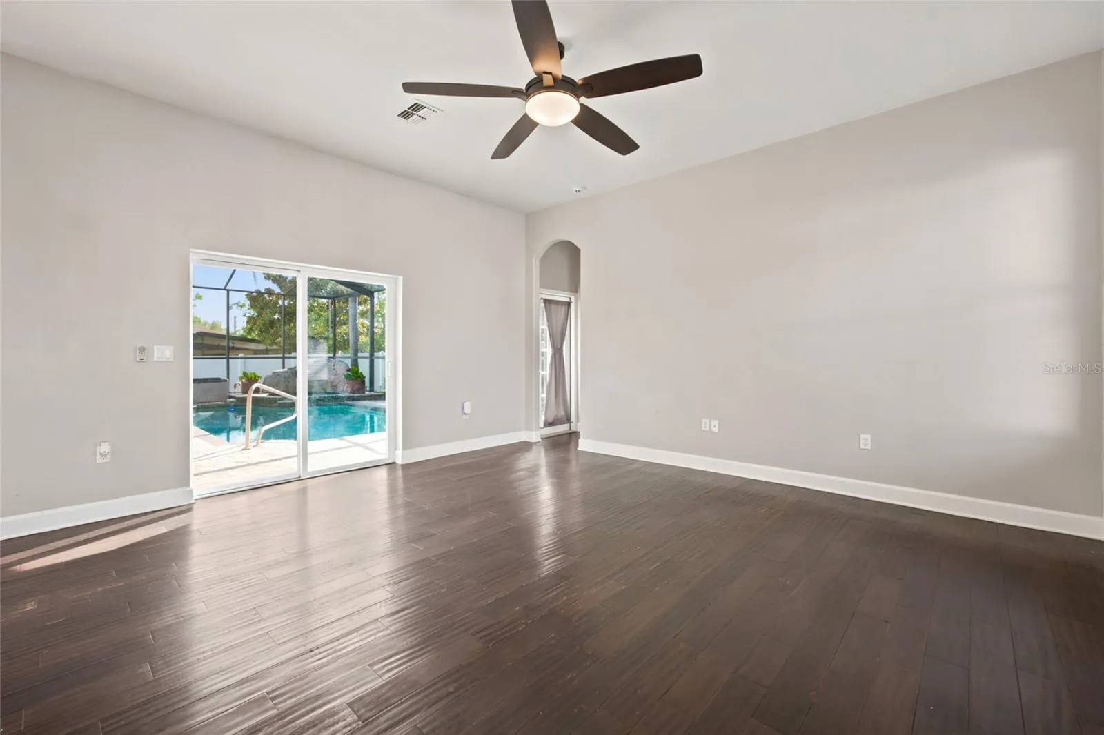 Family Room Overlooks Pool and open to Kitchen