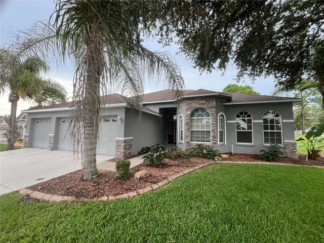 Front View of Property of Pool Home - Mature Landscaping and Maintaned