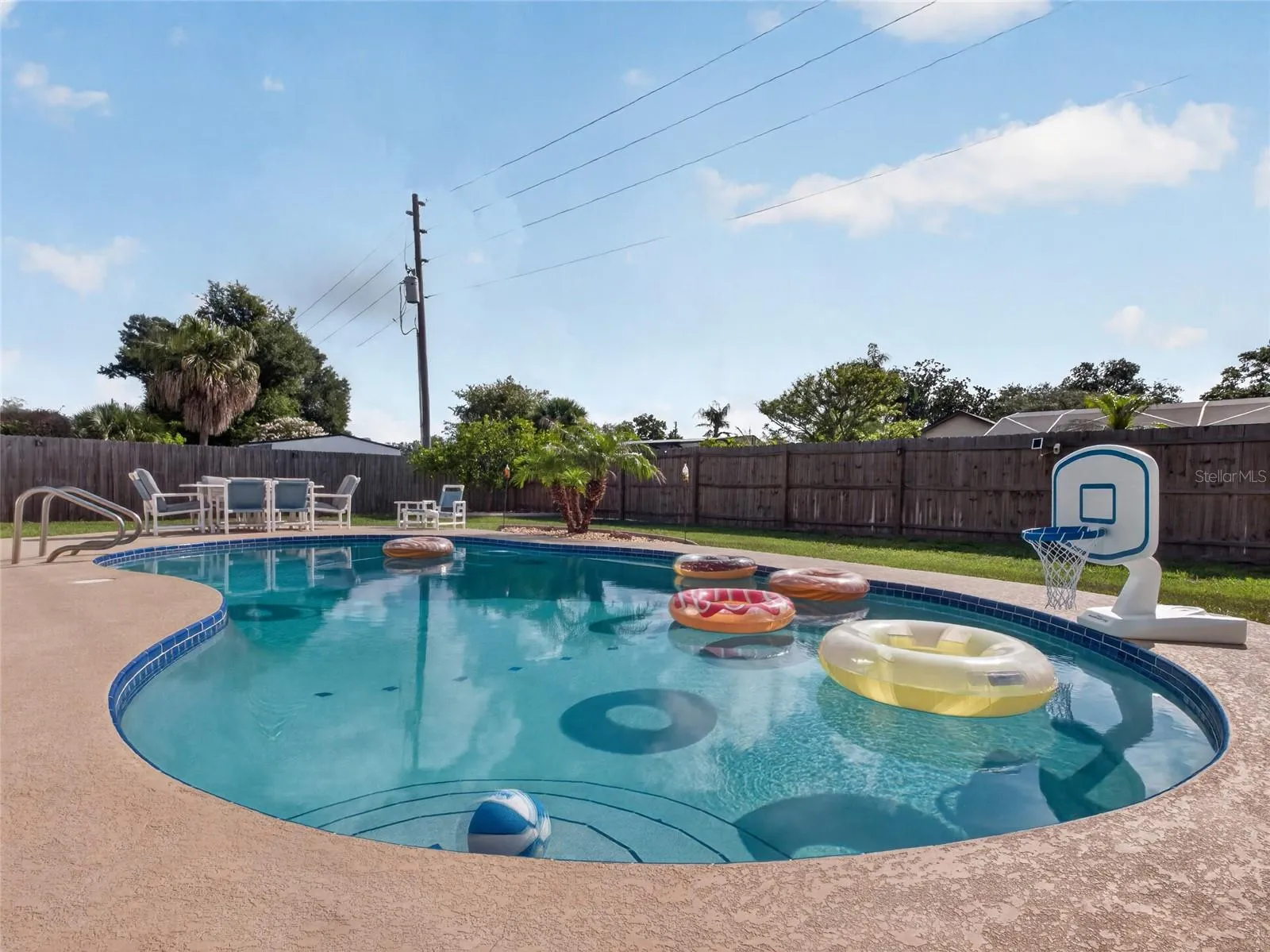 Pool Features Walk-in Steps and a Climb-in Ladder