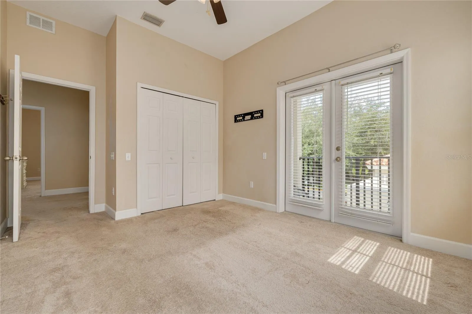 3rd Bedroom with  doors to Balcony overlooking the pool