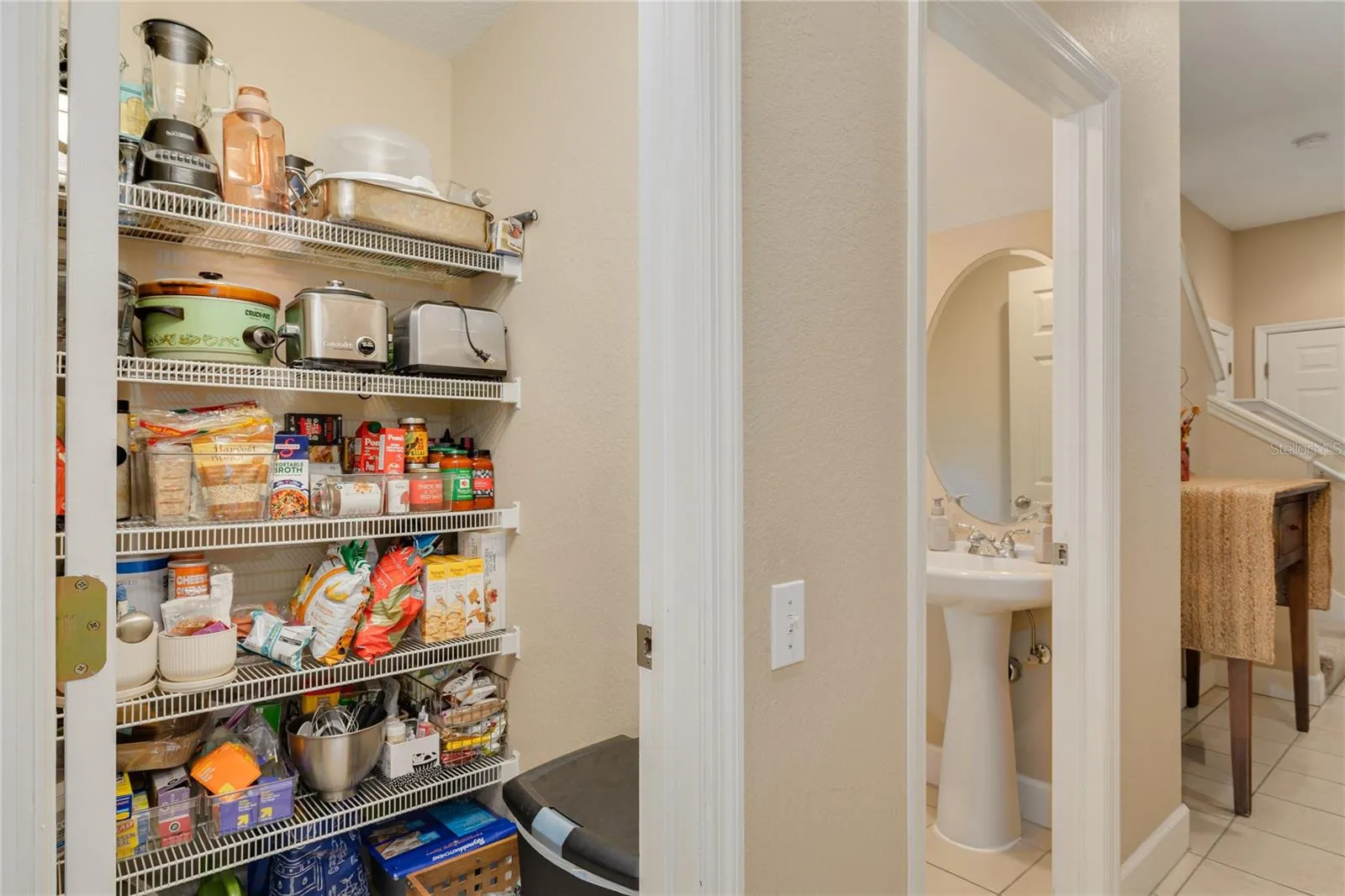 Pantry closet across from kitchen