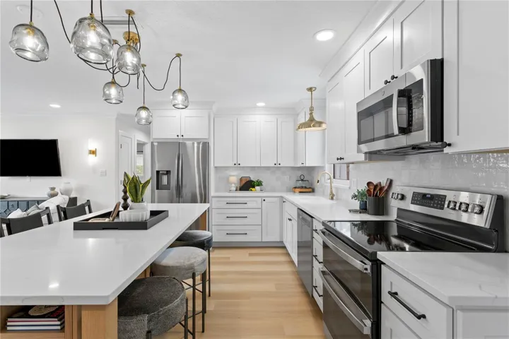 This unique island allows seating on all sides perfect for every day life and entertaining!