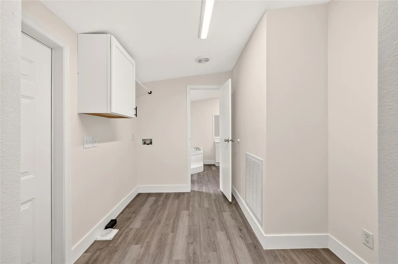 Laundry room with separate entry off Kitchen with Primary bathroom entry